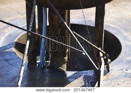 Pump sump in the tank of a sewage treatment plant, which was emptied for work