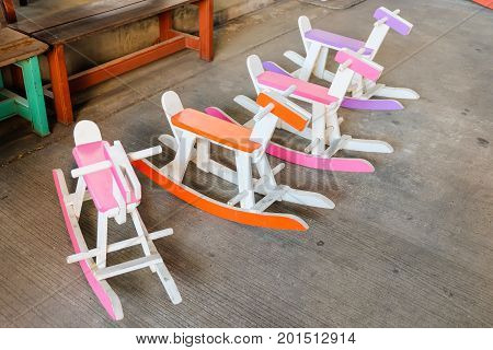 Colorful vintage rocking horse wooden chair for children could enjoy Thailand.