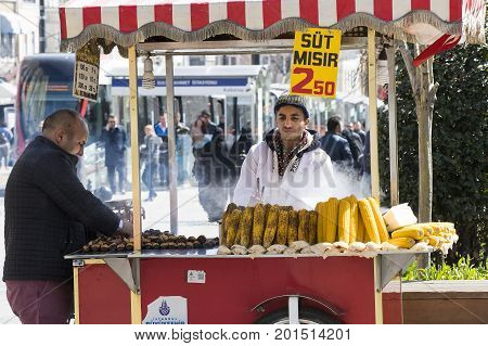 ISTANBUL, TURKEY - 1 APRIL , 2017:Sellers of fried corn chestnuts in the streets of Istanbul in Turkey