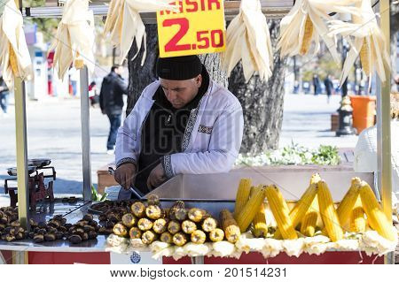 ISTANBUL, TURKEY - 1 APRIL , 2017:Sellers of fried corn chestnuts in the streets of Istanbul in Turkey