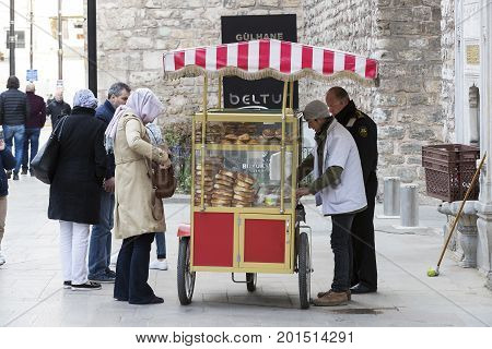 ISTANBUL, TURKEY - 1 APRIL , 2017:Street sales of traditional Turkish bagels Simit, are on the streets of Istanbul in Turkey