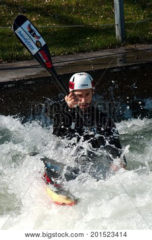 AUGSBURG, GERMANY - MARCH 28, 2017: Kayac slalom training to qualify for the Whitewater National Championships in Ottawa Canada 2017 using the course for the Summer Olympic Games in Germany in 1972.