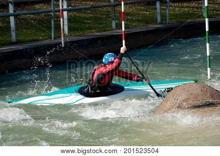 AUGSBURG, GERMANY - MARCH 28, 2017: Kayac slalom training to qualify for the Whitewater National Championships in Ottawa Canada 2017 using the course for the Summer Olympic Games in Germany in 1972.