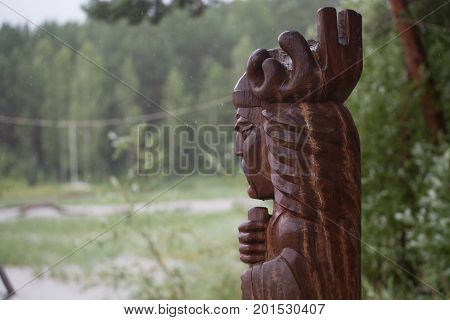 Wooden figure in the forest photo for you