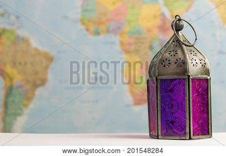 a colourful traditional lantern on a world map background