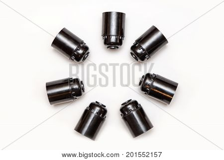 Set of plastic and ceramic electric cartriges for bulb isolated on white. Top view.