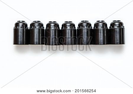 Set of plastic and ceramic electric cartriges for bulb isolated on white. Top view