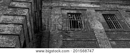 an old abandoned building with broken Windows brings sadness and longing
