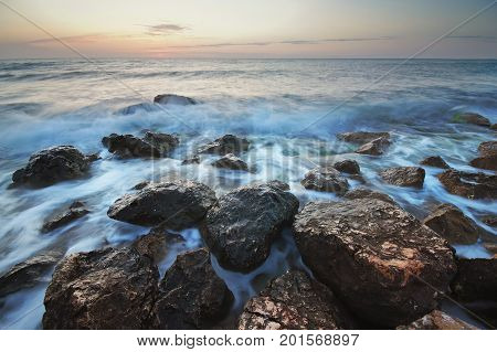 Beautiful seascape. Composition of nature. Stones on the seashore