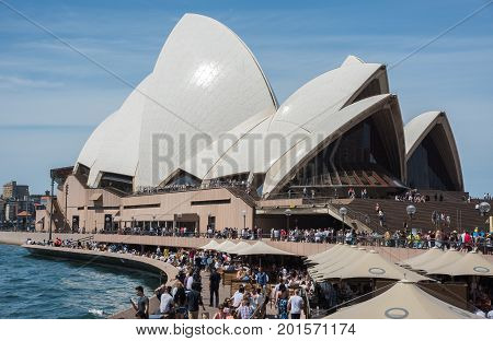 SYDNEY,NSW,AUSTRALIA-NOVEMBER 20,2016: Weekend crowds at the Sydney Opera House and Bar at Bennelong Point in Sydney, Australia