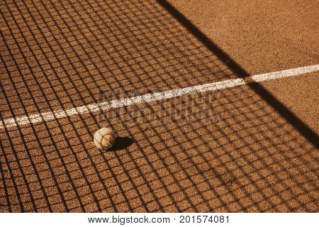 Tennis court with tennis ball in brown tones