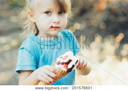 Beautiful Girl Five Years Eating Ice Cream In Nature