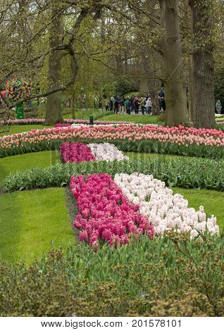 LISSE NETHERLANDS - APRIL 19 2017: Visitors at the Keukenhof Garden in Lisse Holland Netherlands.