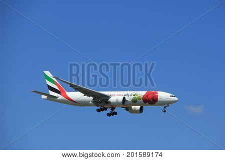 Amsterdam the Netherlands - July 9th 2017: A6-EFL Emirates Boeing 777 approaching Schiphol Amsterdam Airport Kaagbaan runway Red Rose livery
