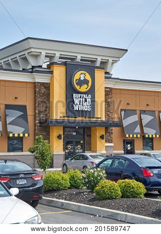 PLATTSBURGH USA - AUGUST 23 2017 : Buffalo Wild Wings restaurant and logo. Buffalo Wild Wings is an American casual dining restaurant and sports bar franchise