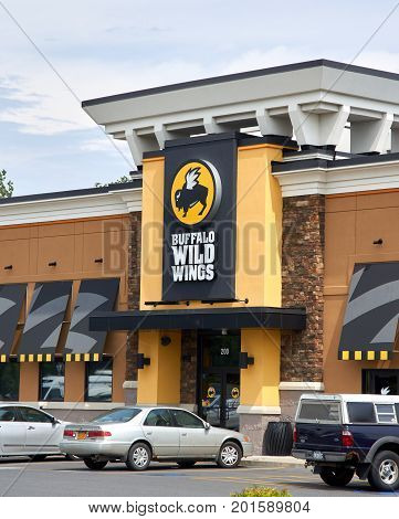 PLATTSBURGH USA - AUGUST 23 2017 : Buffalo Wild Wings restaurant and logo. Buffalo Wild Wings is an American casual dining restaurant and sports bar franchise