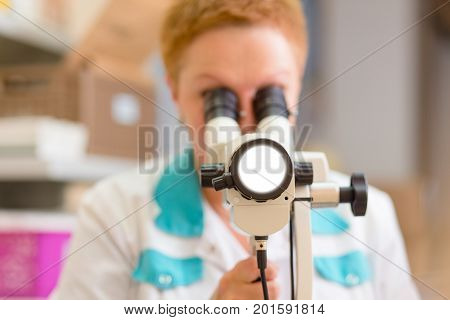 Woman Gynecologist Working With Colposcope