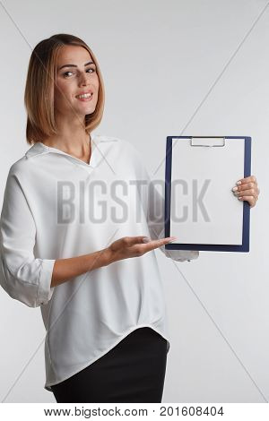Portrait Young Businesswoman Showing Blank Clipboard. Agent