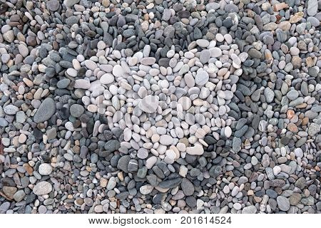 love, the heart of a pebble stone on the sea, on vacation