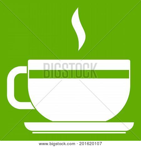 Tea cup and saucer icon white isolated on green background. Vector illustration