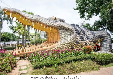 Phichit, Thailand - 9 July 2017 : Big crocodile statue in public park of Bueng See Fai, Phichit Province, Thailand.