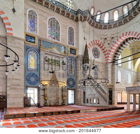 Istanbul, Turkey - April 19, 2017: Marble floral golden ornate minbar (Platform) and niche Suleymaniye Mosque Istanbul Turkey