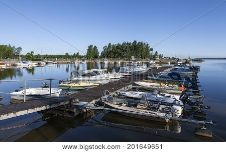 KOKKOLA, FINLAND ON JULY 07. View of a marina this side a cape by the sea on July 07, 2017 in Kokkola, Finland. Morning and bright sunshine. Bridge. Editorial use.