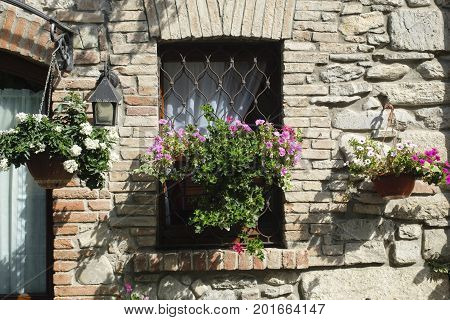 Nibbiano (Piacenza Emilia-Romagna Italy): old typical house exterior with plants and flowers