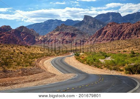 Road into Red Rock Canyon in Nevada with mountains in background