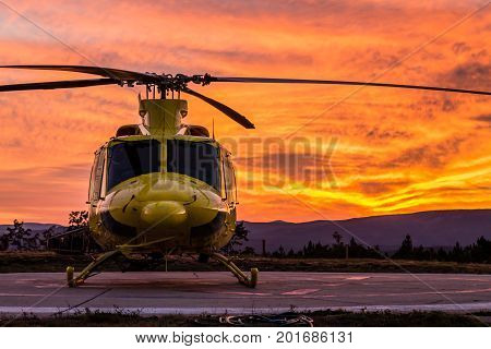 A wildfire helicopter view on a spectacular sunset