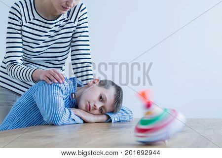 Son Looking At Colorful Toy