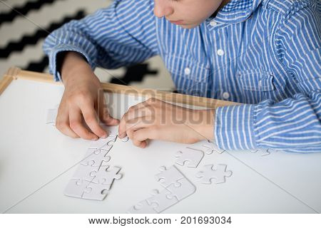 Boy Doing Puzzles