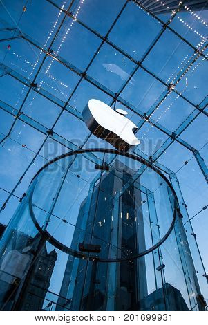 NEW YORK CITY - Dec 16, 2010:  Apple Store cube on 5th Avenue. Apple logo at Apple store on 5th ave. the glass front of the store looking up at logo in Manhattan, Dec 16, 2010 in New York City, USA.