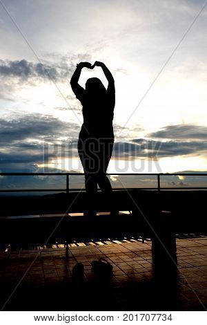 Silhouette of people Heart-shaped handmade in mountainview