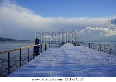 Marine boat dock in a sub-tropical country under a layer of snow