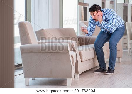 Young man shopping in furniture store