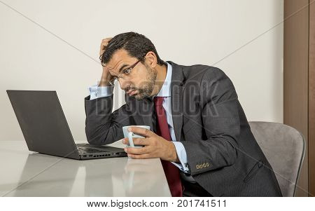 Arab Man Woking In His Laptop In The Kitchen