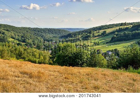 Rural summer landscape. A village in a beautiful Jurassic valley in Poland.