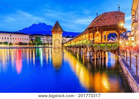 Lucerne Switzerland. Historic city center with its famous Chapel Bridge and Mt. Pilatus on the background. (Vierwaldstattersee)