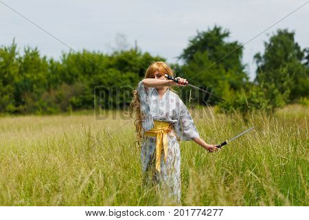 Portrait Of Samurai Girl With A Sword