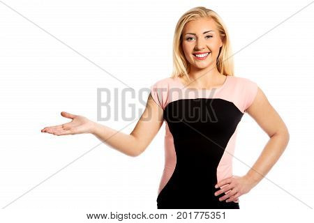 The portrait of young woman showing on side.