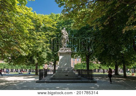 Paris France - August 13 2016: Statue of Louis XIII on the Place des Vosges in Paris. This place is the oldest planned square in Paris and one of the finest in the city.