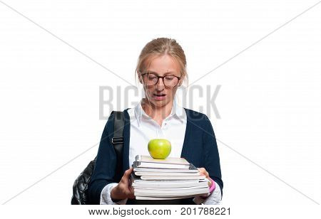 Young student girl holding books high school or college graduand standing isolated on white background. Back to school