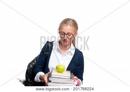 Young student girl holding books high school or college graduand standing isolated on white background. Back to school
