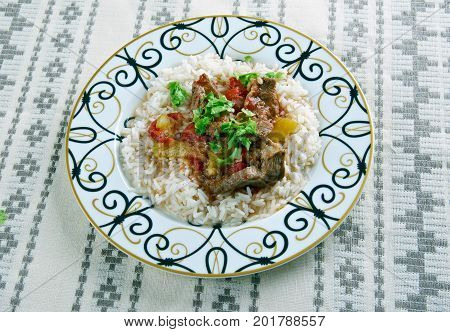 Alinazik kebab - home-style Turkish dish . topped cubes of sauteed lamb served with rice pilaf.