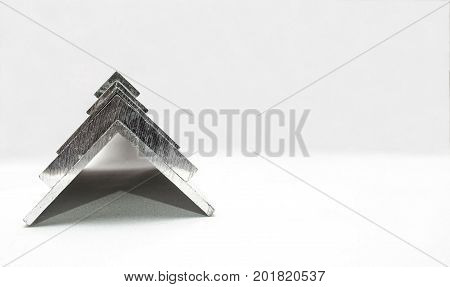 Tree from metal profiles on white background