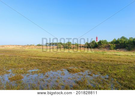 Lighthouse red and white at the French west beach