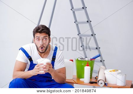 Repairman doing renovation repair in the house with paper wallpa