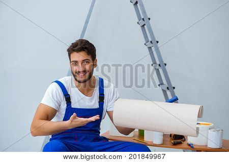 Repairman doing renovation repair in the house with paper wallpa
