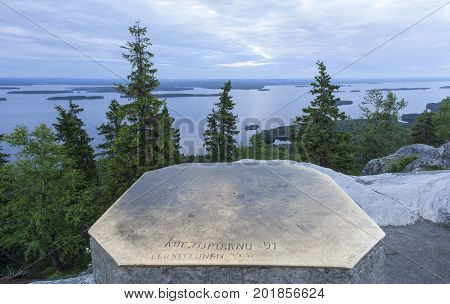 UKKO-KOLI HILL, FINLAND ON JULY 05. View of lake Pielinen from a rock, cliff on July 05, 2017 in Ukko-Koli Hill, Finland. Unidentified landmark at the outlook. Editorial use.